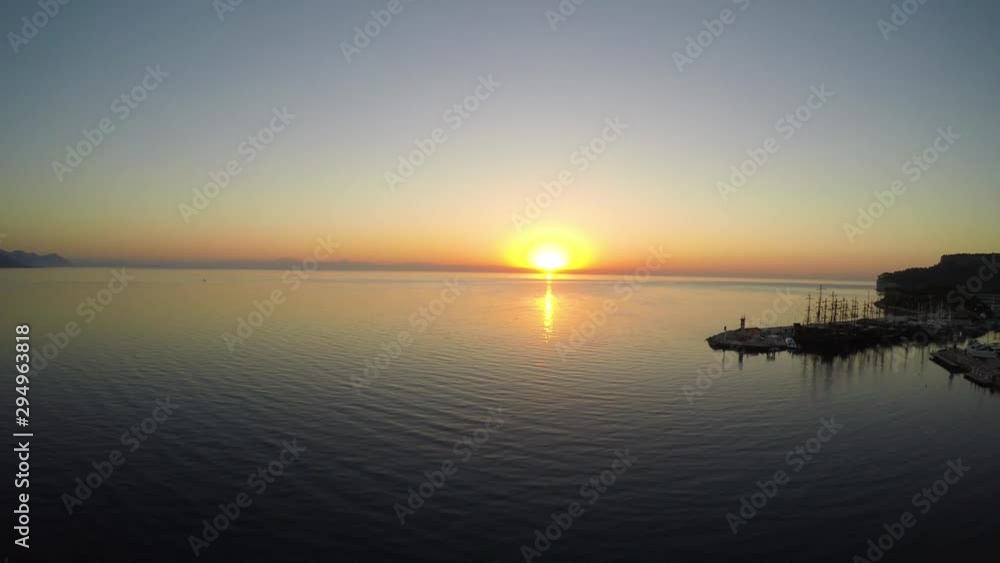 Aerial view of sunrise from the sea. Aerial slow flight left. Movement to the sun over the sea. Aerial view of sunrise from the sea. Aerial slow flight left. Movement to the sun over the sea.