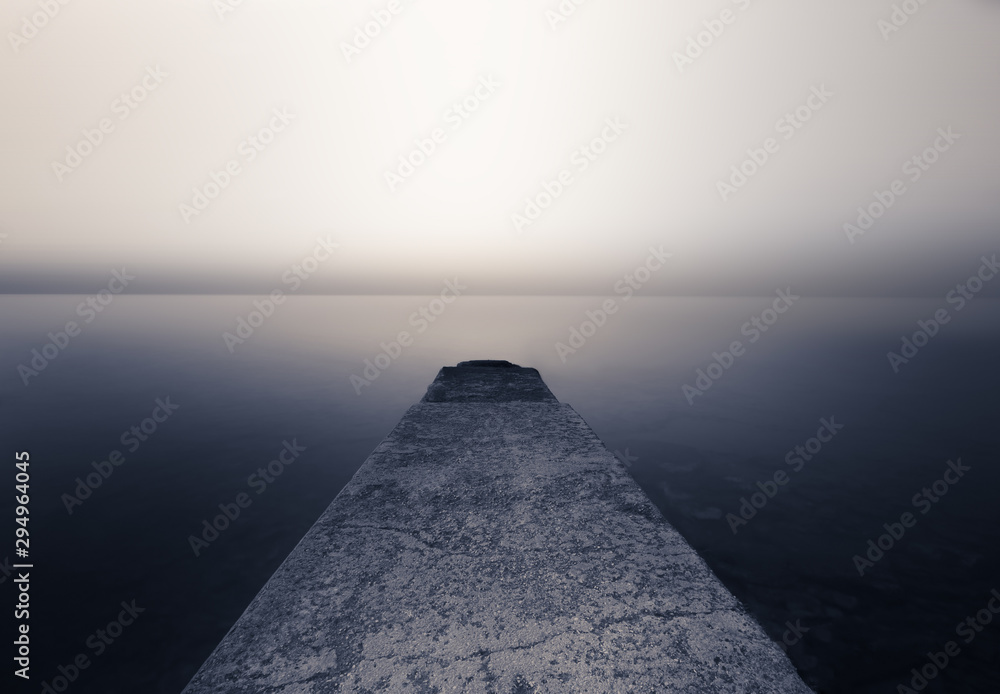 Perspective Cement pier with beautiful sea nature background. Abstract long exposure photography gradient wallpaper advertise. Concept desktop relax