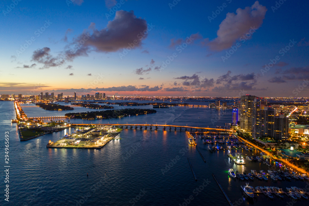 Beautiful night in MIami Beach image shows bridges buildings and islands on Biscayne Bay