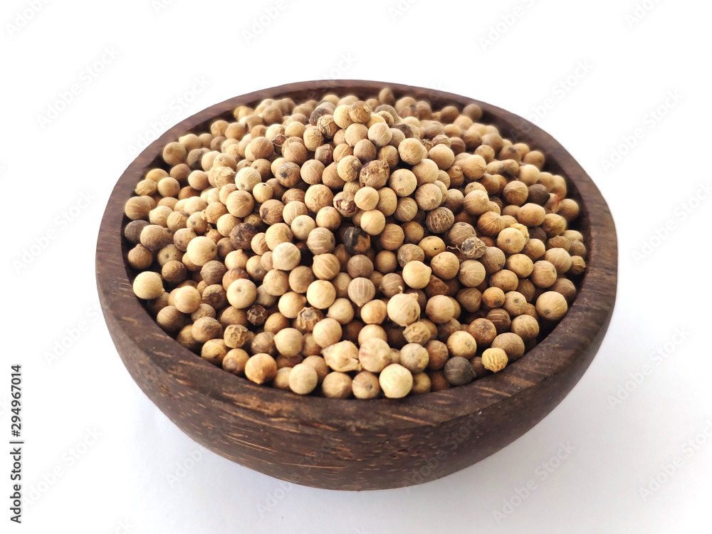 Piper Albi Linn / White Pepper (known as Lada or Merica Putih in Indonesia) on a wooden bowl at white background Piper Albi Linn / White Pepper (known as Lada or Merica Putih in Indonesia) on a wooden bowl at white background