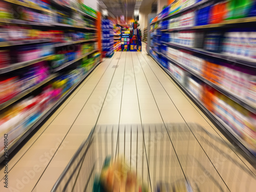 Abstract blurry motion in supermarket interior retail and shopping mall. Concept consumism background. photo