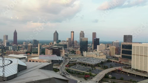 4K Ariel Drone Shot Passing Over Mercedes-Benz Stadium In Atlanta, Georgia USA. Car Stadium, Tall Skyline Buildings In USA. Tall Important Buildings. Cloudy Blue Sky, Pretty Buildings photo