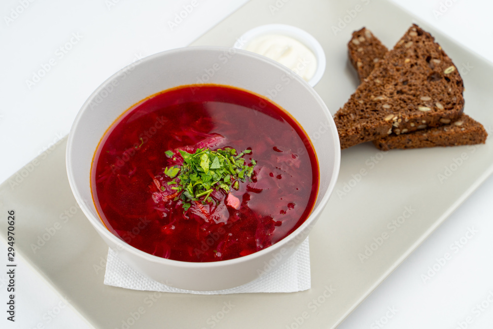 Classic russian beetroot soup: borscht with vegetables, garlic toasts and fresh sour cream Classic russian beetroot soup: borscht with vegetables, garlic toasts and fresh sour cream