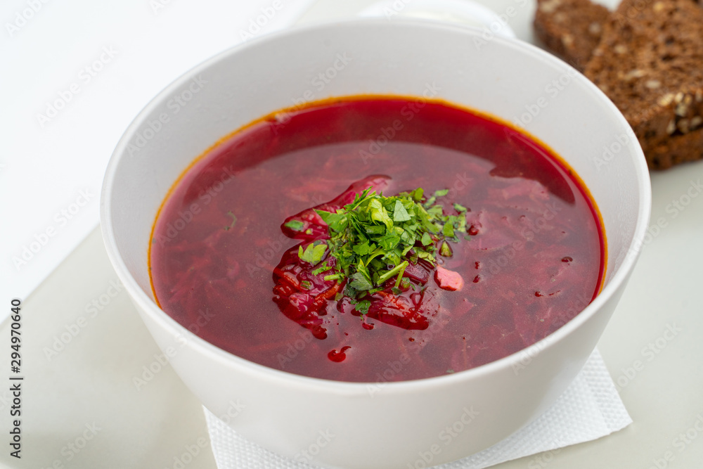 Classic russian beetroot soup: borscht with vegetables, garlic toasts and fresh sour cream Classic russian beetroot soup: borscht with vegetables, garlic toasts and fresh sour cream