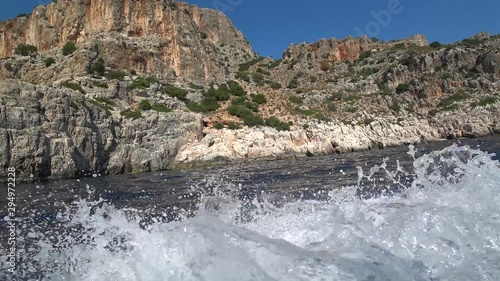 Castellorizo, Greece - 1st of October 2019: 4K Driving on motorboat along the seacoast of the Castellorizo island photo