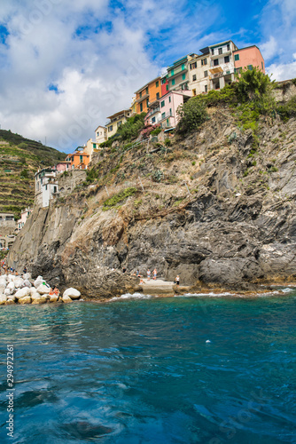 Obraz na płótnie Cinque Terre, Italy - August 17, 2019: Boat trip along the Ligurian coast. Mountain landscape with residential buildings. w salonie