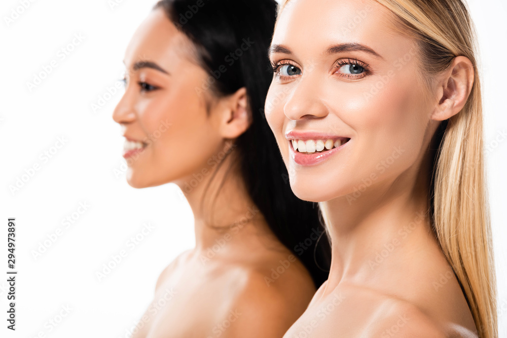 selective focus of smiling naked blonde woman near asian girl isolated on white selective focus of smiling naked blonde woman near asian girl isolated on white