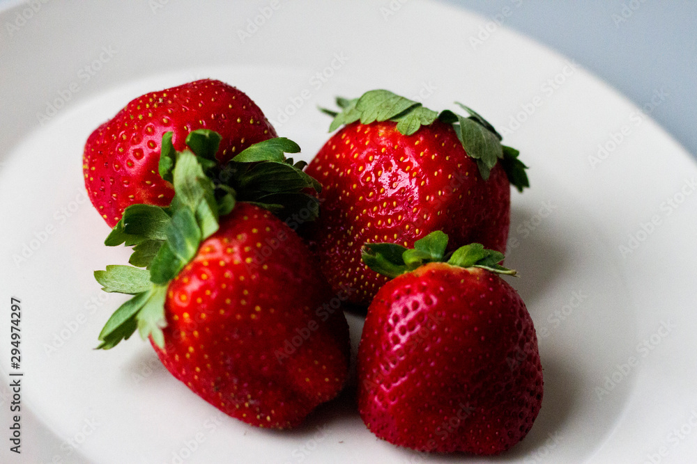 four strawberries four strawberries