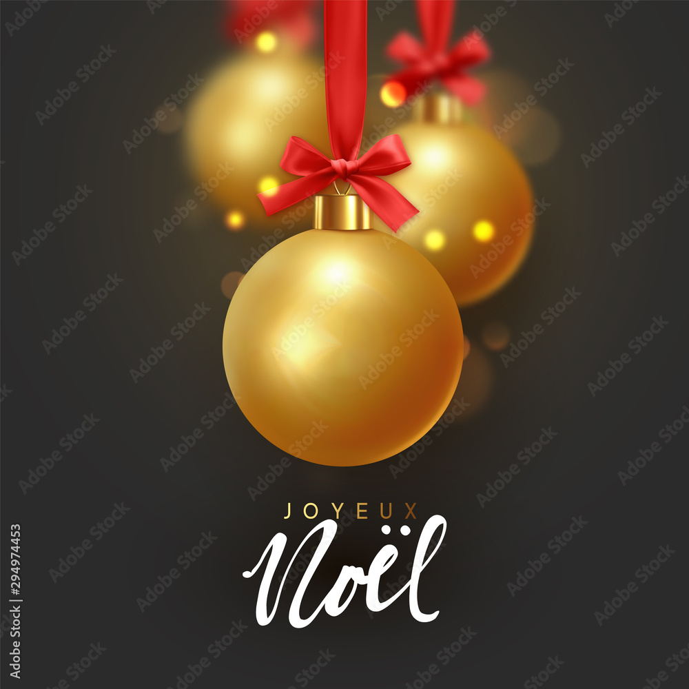 French text Joyeux Noel. Christmas golden balls hang on red ribbon with bow. Xmas bauble with realistic light blur bokeh effect. French text Joyeux Noel. Christmas golden balls hang on red ribbon with bow. Xmas bauble with realistic light blur bokeh effect.
