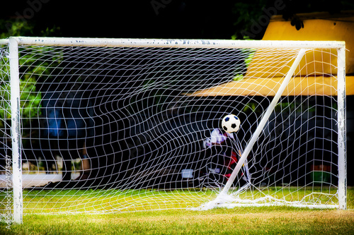 A football ball that hits the net