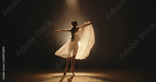 Cool female ballet dancer showing an artpiece on stage, doing different moves - arts, way to success concept 4k footage photo