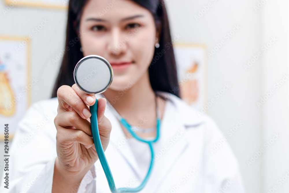 Beautiful doctor carrying medical stethoscope to check the health of patients in the clinic. Beautiful doctor carrying medical stethoscope to check the health of patients in the clinic.