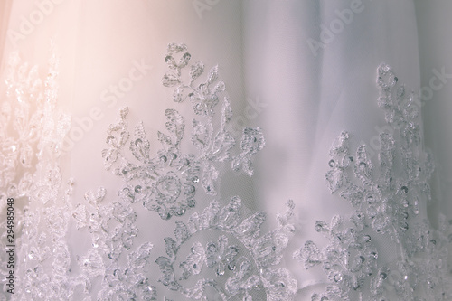 Details of the bride dress fabric and beautiful embroidery wedding concept used as a background for illustrations