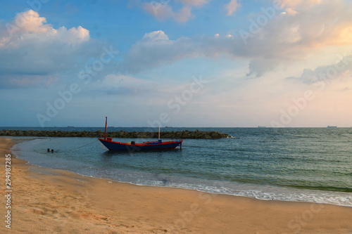  fishing boat At the coast There are many fishing boats at the pier. During the sunset