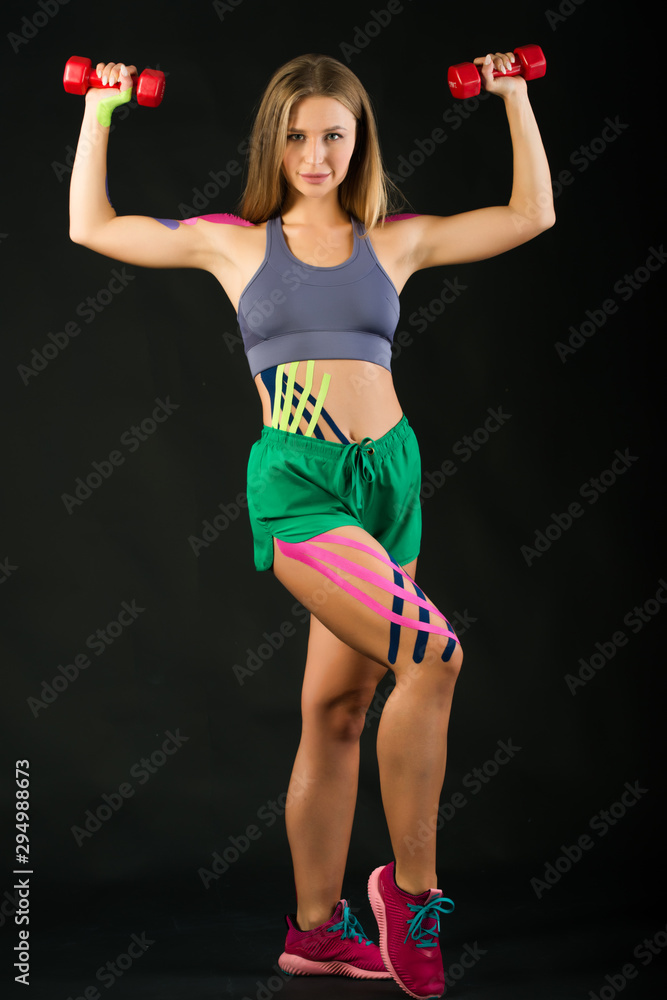 Power dumbbells training, kinesio tape Power dumbbells training, kinesio tape