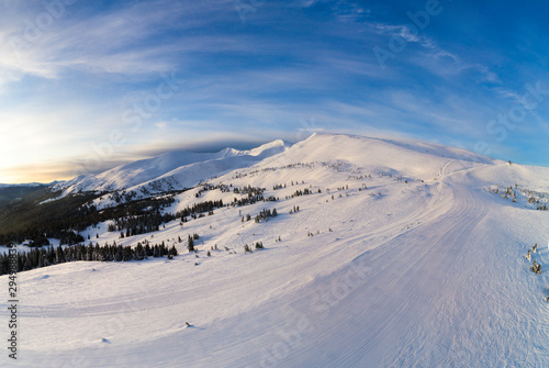 Picturesque winter panorama of mountain hills