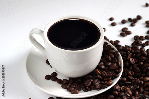 coffee cup with coffee beans isolated on white background
