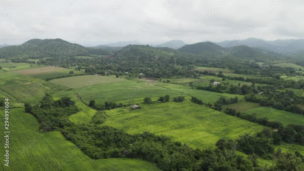 4K Aerial Drone Video Of Tropical Lush Jungle and farmland with mountains surrounding Kanchanaburi Thailand 4K Aerial Drone Video Of Tropical Lush Jungle and farmland with mountains surrounding Kanchanaburi Thailand