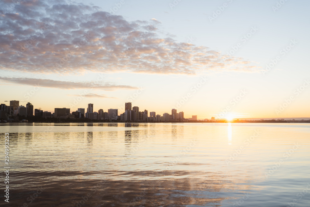 The Perth city skyline at sunrise. Iconic skyline with magical golden light behind it. 