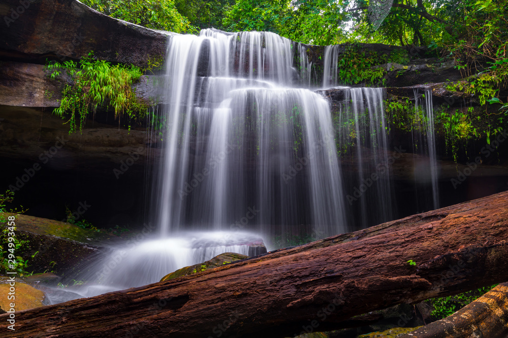 Khun Sri waterfall in tropical forest Thailand leaf moving low speed shutter blur.Unseen in Sisaket province,Thailand.