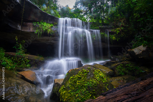 Khun Sri waterfall in tropical forest Thailand leaf moving low speed shutter blur.Unseen in Sisaket province Thailand.