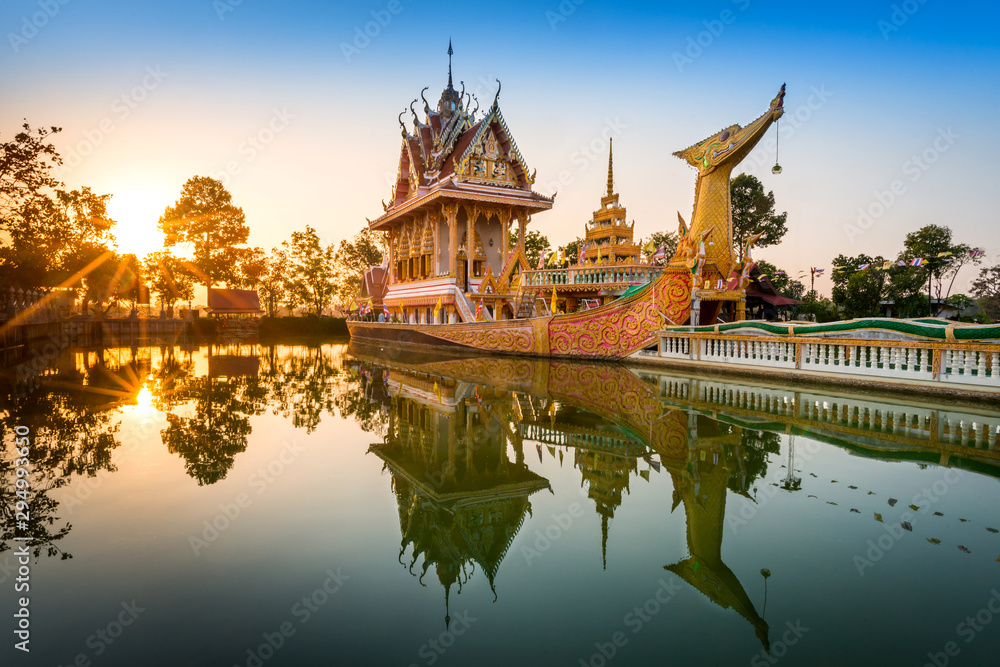 Panorama A huge Thai Suphannahong, also called Golden Swan or Phoenix boat at the WatpahSuphannahong Temple twilight time in sisaket, Thailand.Warm tone concept.