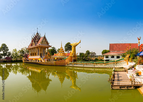 Panorama A huge Thai Suphannahong  also called Golden Swan or Phoenix boat at the WatpahSuphannahong Temple twilight time in sisaket  Thailand.Warm tone concept.