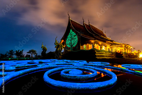 Amazing Temple Sirindhorn Wararam Phuproud in Ubon Ratchathani Province at twilight time,Thailand.Thai temple with grain and select white balance.Night sky effect for Long exposure photo taken. © noon@photo