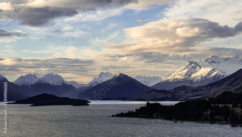 Sunset over the stunning snow capped mountain in the Glenorchy area and lake Wakapitu in Queenstown in New Zealand