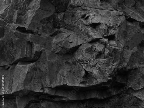 Obraz na płótnie Rock texture. Dark black grunge stone texture background. Fragment of a mountain close-up. w salonie
