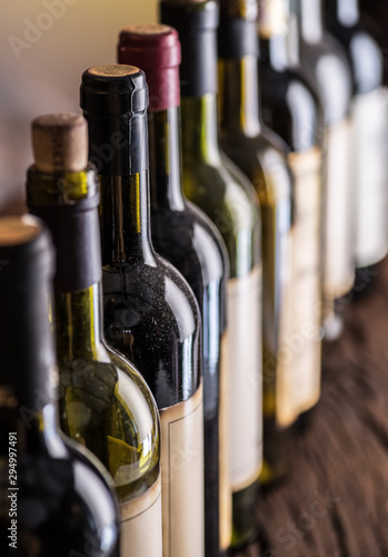 Line of wine bottles. Close-up. photo