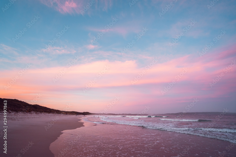 Epic pink and purple sunset over Cosy Corner Beach in Albany, Western Australia. Beautiful vibrant colours in the sky over the beach. Epic pink and purple sunset over Cosy Corner Beach in Albany, Western Australia. Beautiful vibrant colours in the sky over the beach.