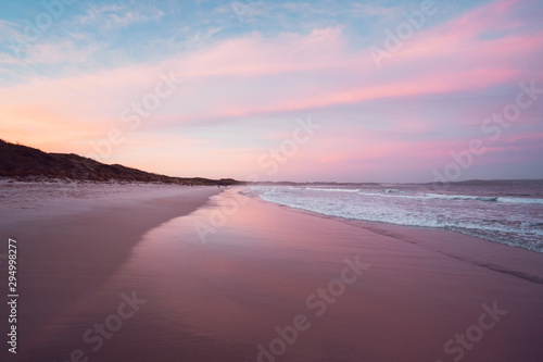 Epic pink and purple sunset over Cosy Corner Beach in Albany, Western Australia. Beautiful vibrant colours in the sky over the beach. 