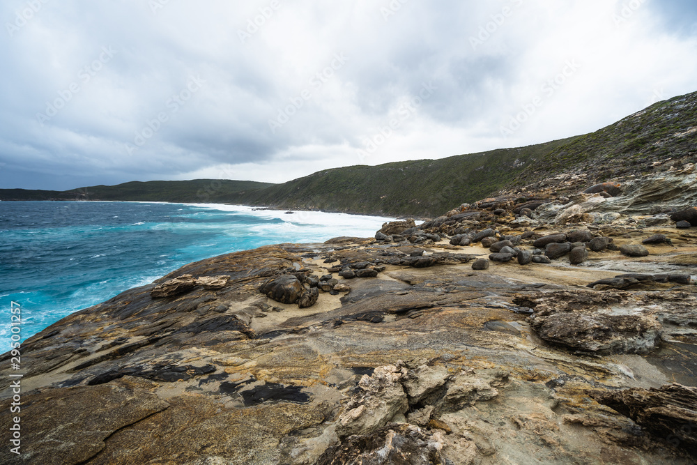 The Natural Gap, Albany, Western Australia. Dramatic and moody landscape with large rough waves breaking on the rocks. 