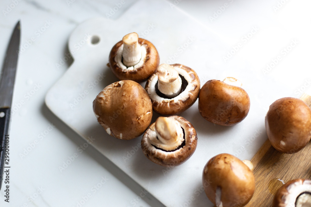 Fresh raw royal champignon on marble board Fresh raw royal champignon on marble board