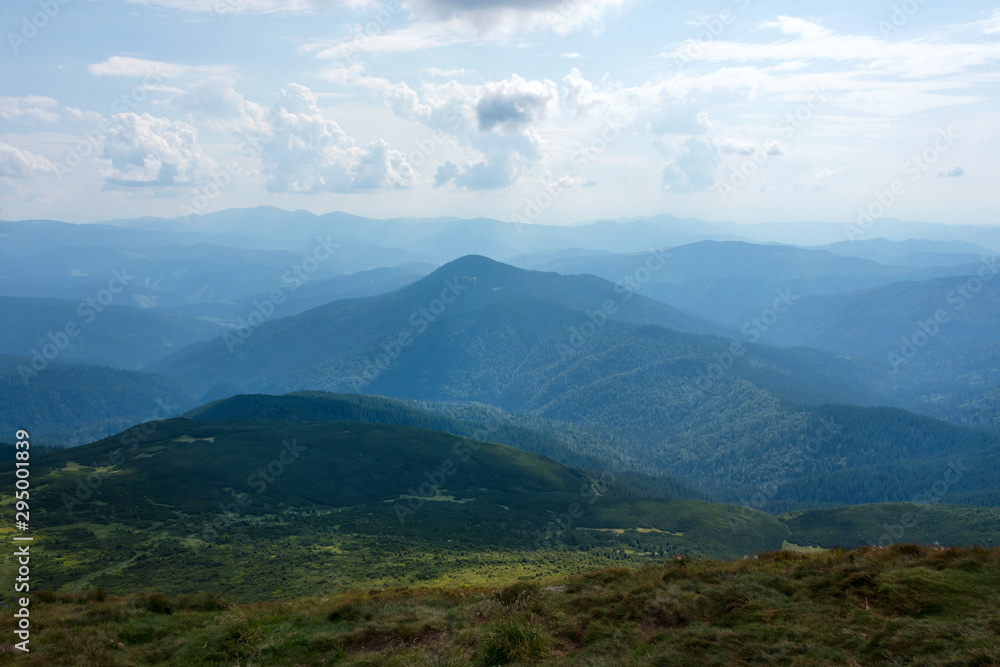 Summer landscape in the Carpathian mountains. View from the mountain peak Hoverla. Ukrainian mountain Carpathian Hoverla, view from the top. Summer landscape in the Carpathian mountains. View from the mountain peak Hoverla. Ukrainian mountain Carpathian Hoverla, view from the top.