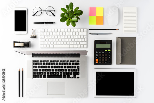 Elegant office desktop with laptop and business accessories. Top view