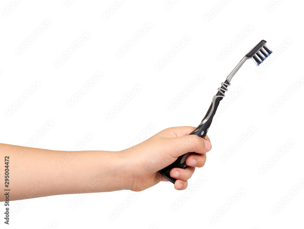 Children hand with black toothbrush, kids tooth care, hygiene and freshness for mouth. Children hand with black toothbrush, kids tooth care, hygiene and freshness for mouth.