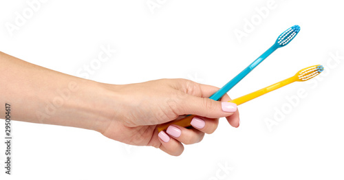 Hand with color toothbrush, dental care and freshness.