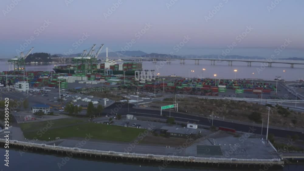 Morning operations in shipping port during sunrise. Beautiful deep color and equipment displayed.