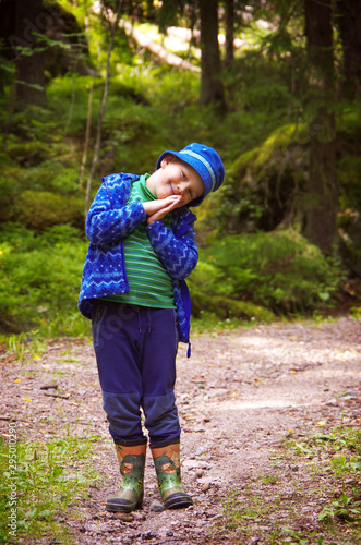 Happy child walking in forest