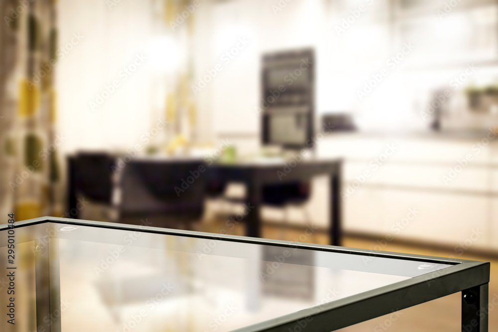 Glass table top with a blurred home interior background. Empty space background for your products and decoration. 
