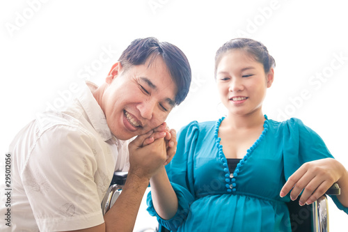 Husband shaking hands pregnant wife He is happy to have children. Family building concept Pregnancy and raising children