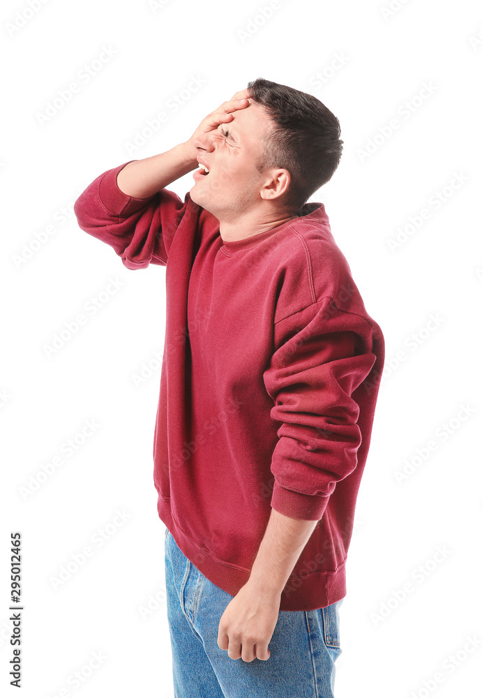 Portrait of young man after making mistake on white background Portrait of young man after making mistake on white background
