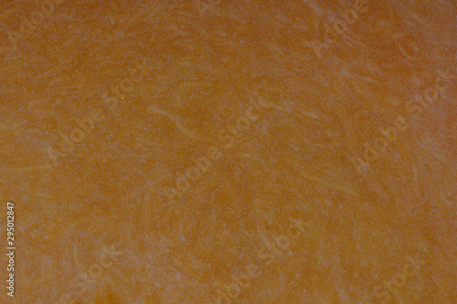 Yellow pumpkin cut in half with the texture of pulp. Pumpkin slices background closeup, top view