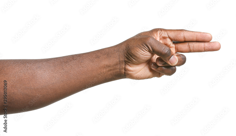 Hand of African-American man pointing at something on white background Hand of African-American man pointing at something on white background