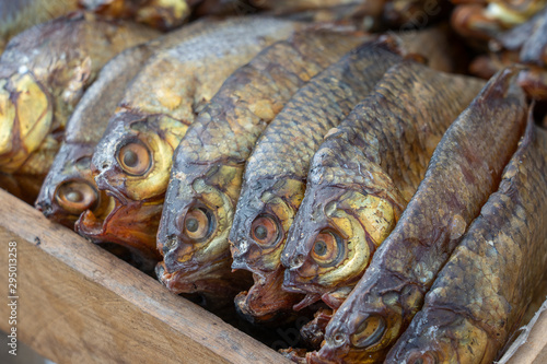 Smoked fish for sell in street food market, Ukraine, closeup