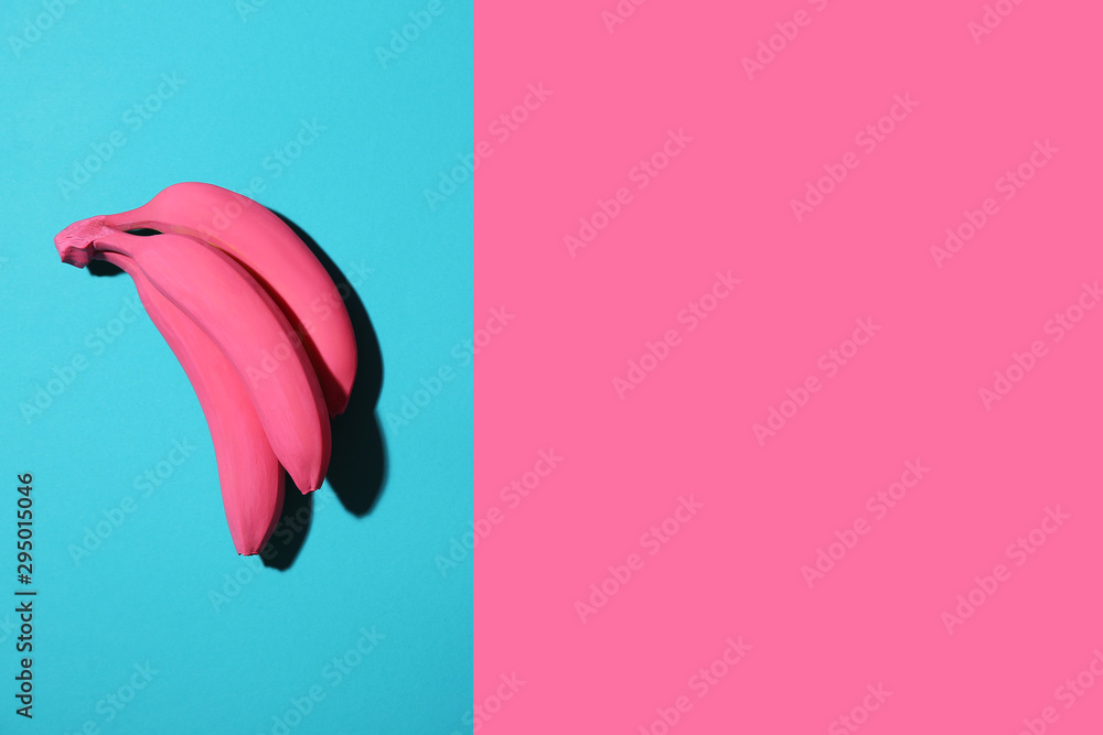 Fototapeta premium Ripe painted bananas on color background