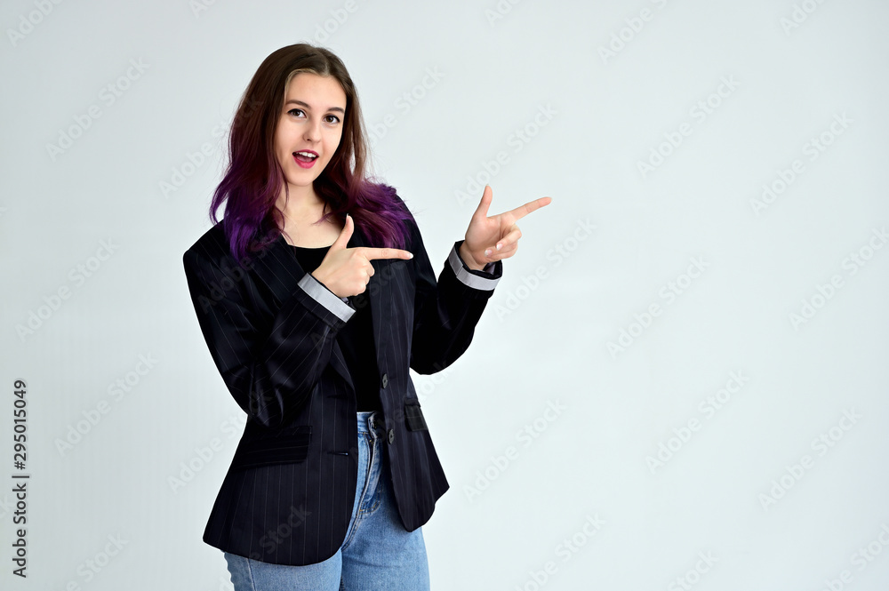 Studio portrait of a pretty brunette student girl with long hair in a jacket on a white background. Smiling at camera with emotions in various poses. Studio portrait of a pretty brunette student girl with long hair in a jacket on a white background. Smiling at camera with emotions in various poses.