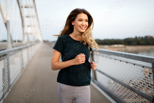 Sporty woman jogging in city to keep her body and soul in shape © NDABCREATIVITY